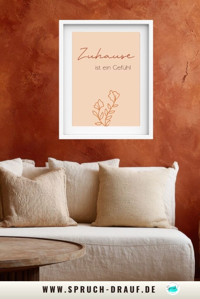 Poster „Zuhause ist ein Gefühl“ als warme Wanddeko im Wohnzimmer